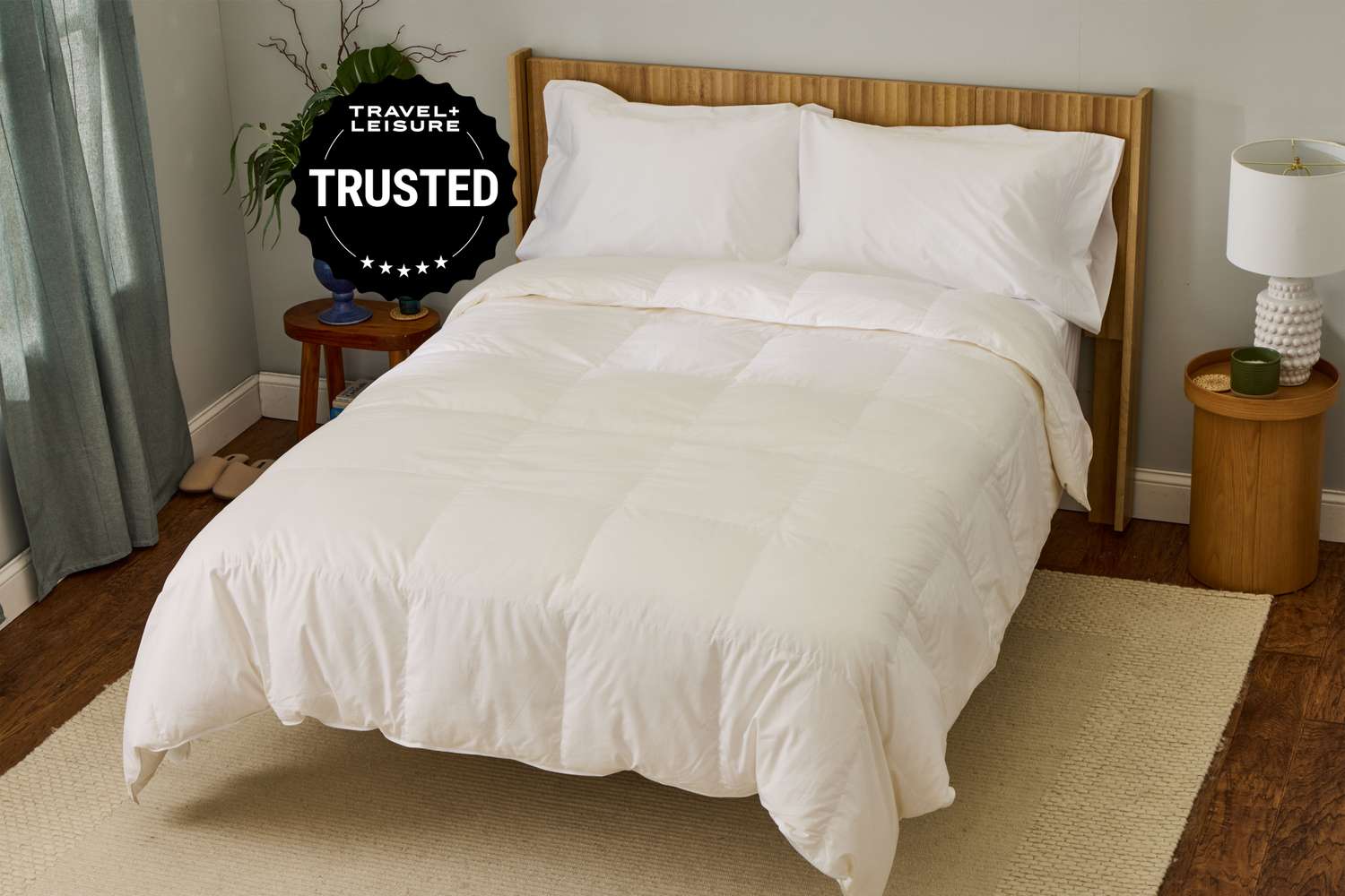 Freshly made bed with crisp white hotel-quality linens in a clean vacation rental bedroom